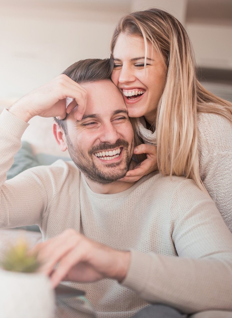 Woman and man laughing